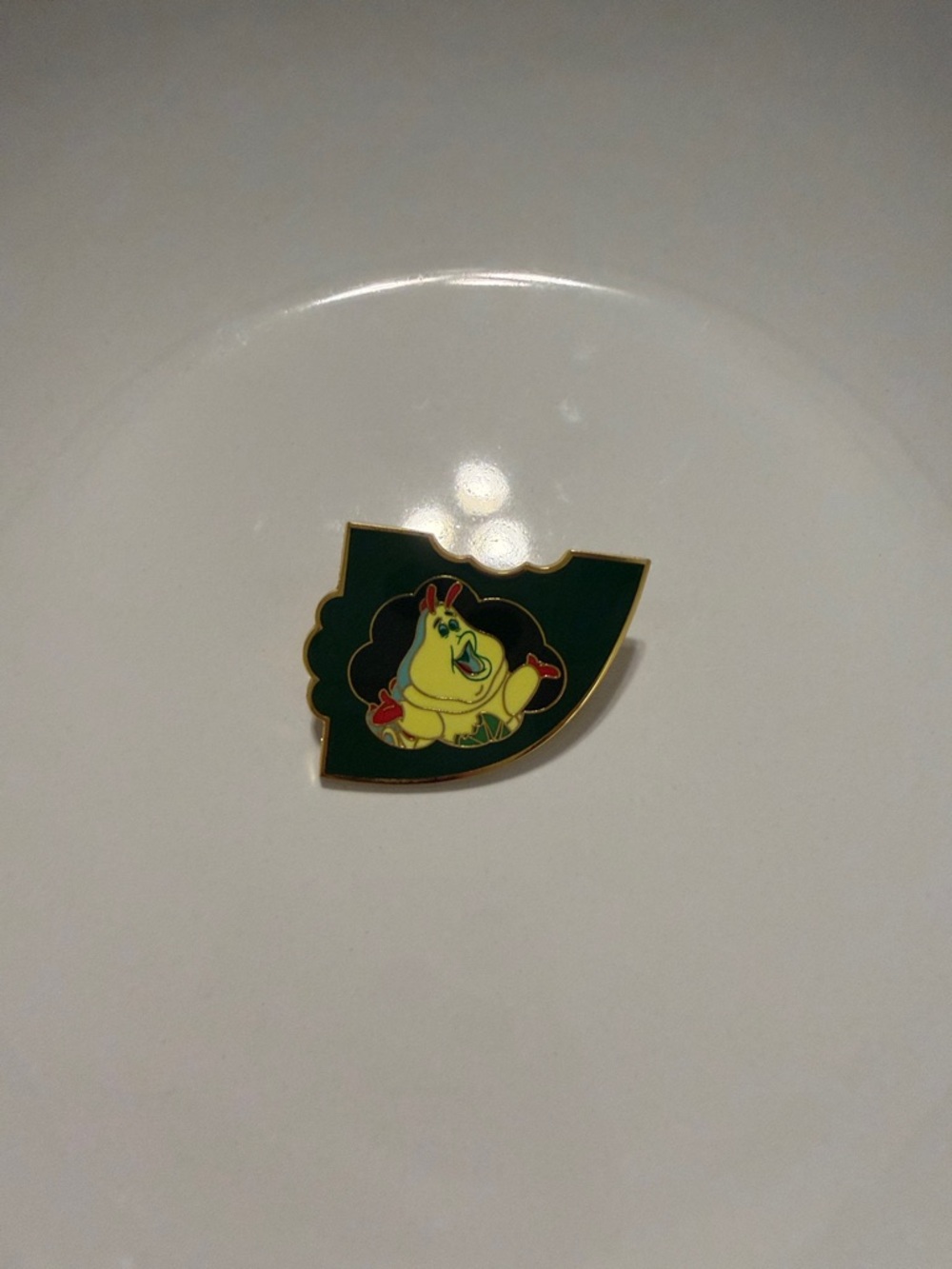 Disney pin featuring Heimlich from A Bug's Life